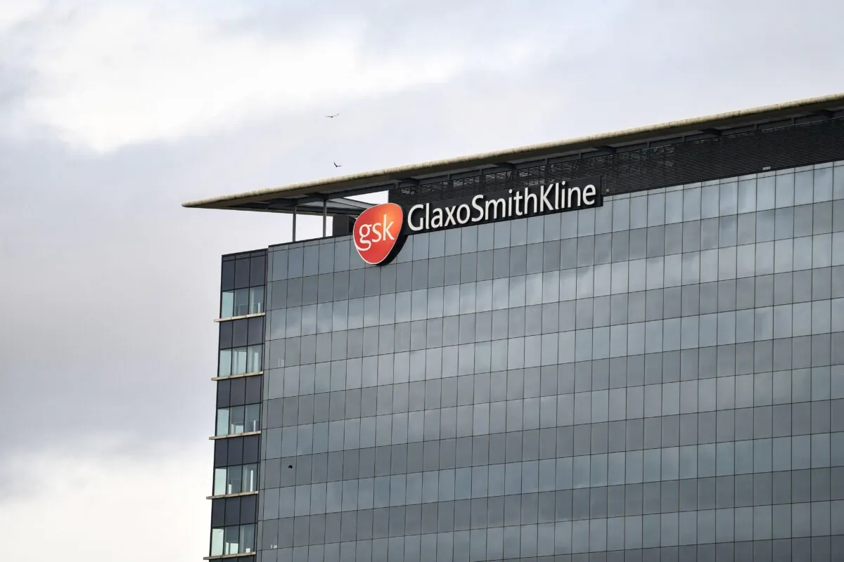 The logo of the British multinational pharmaceutical company GlaxoSmithKline on top of its headquarters in London on Feb. 2, 2022. (Justin Tallis/AFP via Getty Images)