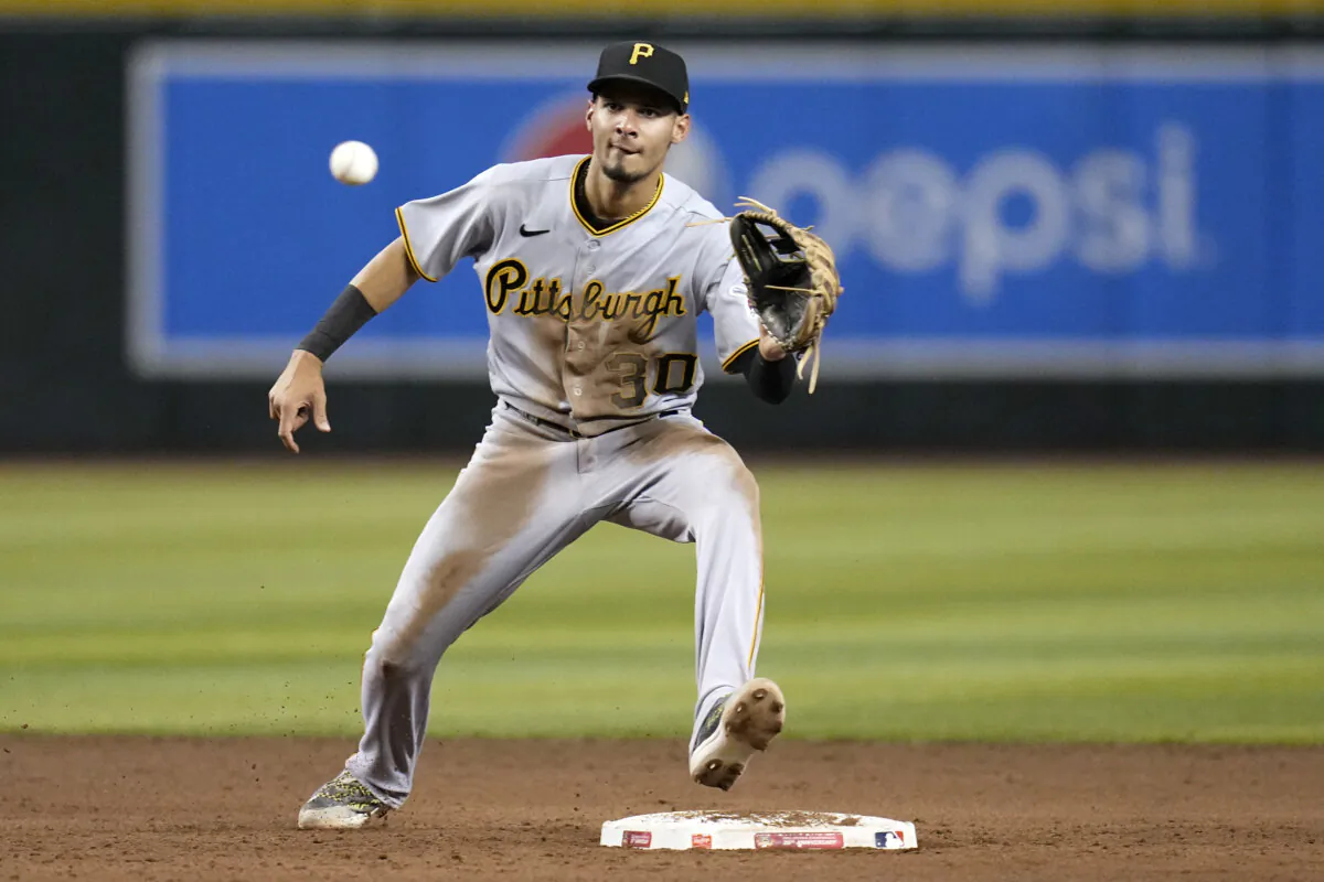 Tucupita Marcano, then playing for the Pittsburgh Pirates, takes a throw at second base during a game against the Arizona Diamondbacks in Phoenix on July 7, 2023. (Ross D. Franklin/AP Photo)