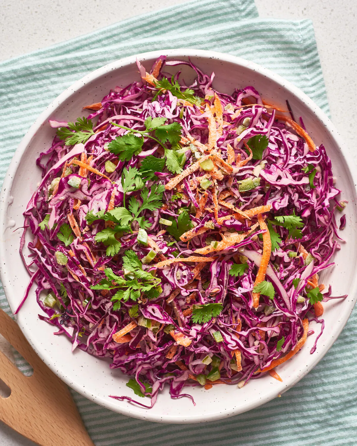 This easy red cabbage and carrot slaw is tossed in a spicy and creamy dressing, perfect for serving alongside tacos. 
(Joe Lingeman/TNS)
