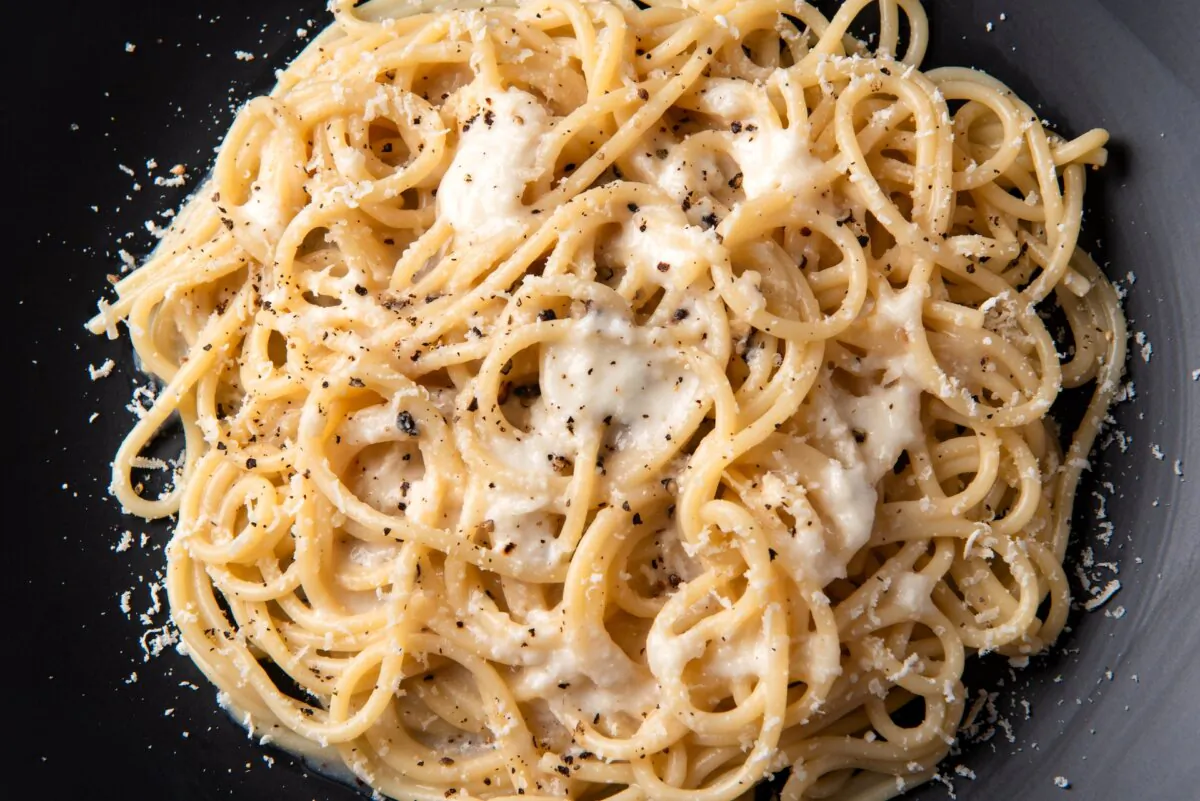 Cacio e pepe traditionally features only pecorino cheese and black pepper, but the dish also welcomes all sorts of add-ins. (Alessio Orru/Shutterstock)