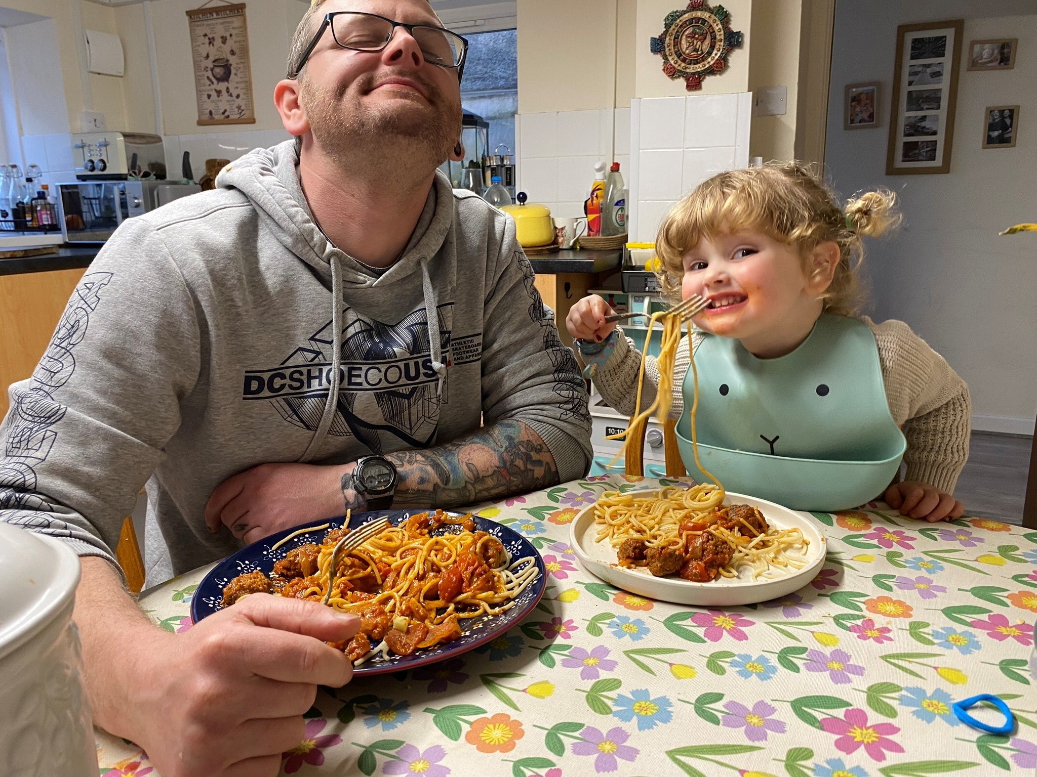 Oswyn eating with her father.