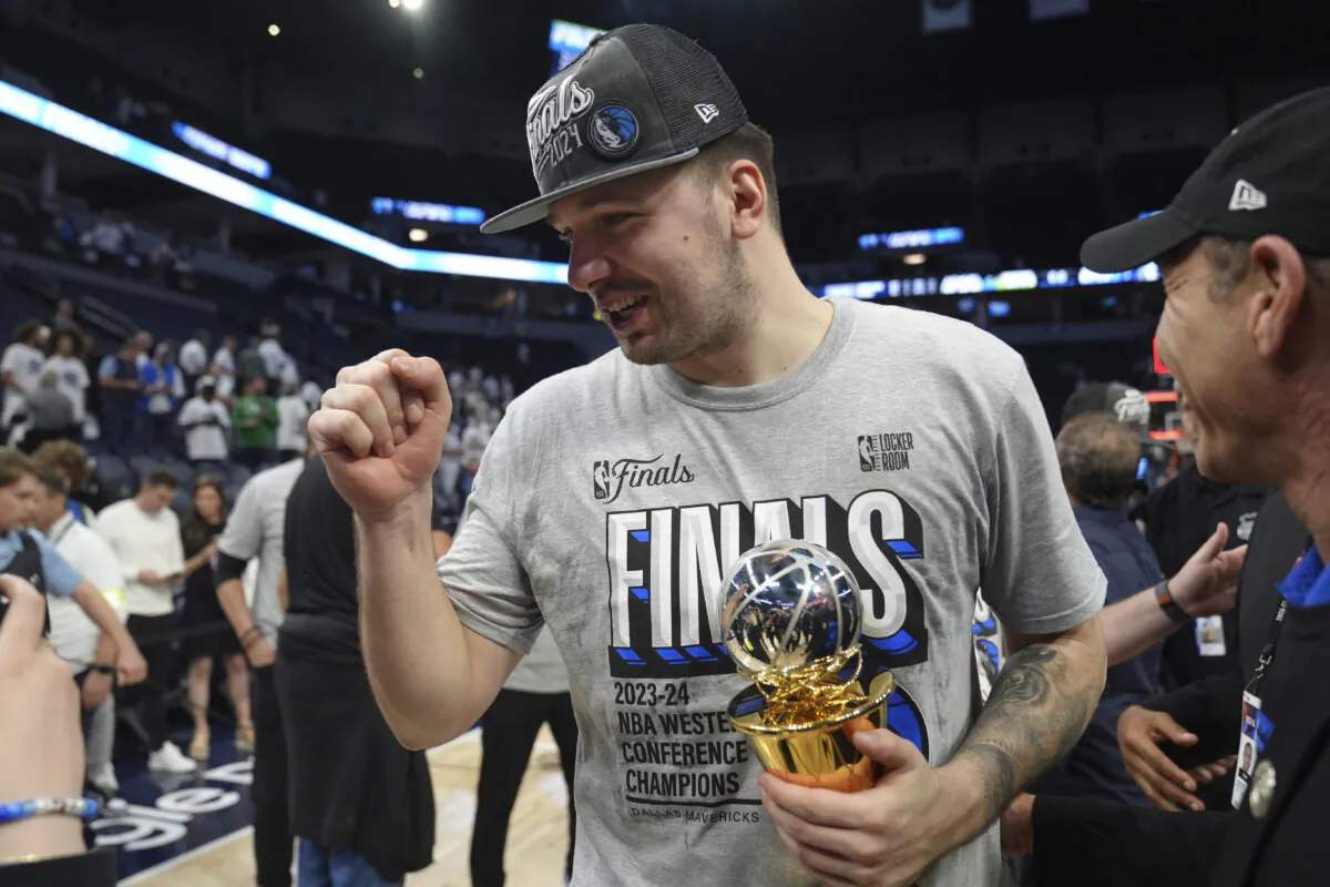 Dallas Mavericks guard Luka Doncic celebrates the team's win over the Minnesota Timberwolves in Game 5 of the Western Conference finals in the NBA basketball playoffs in Minneapolis on May 30, 2024. (Abbie Parr/AP Photo)