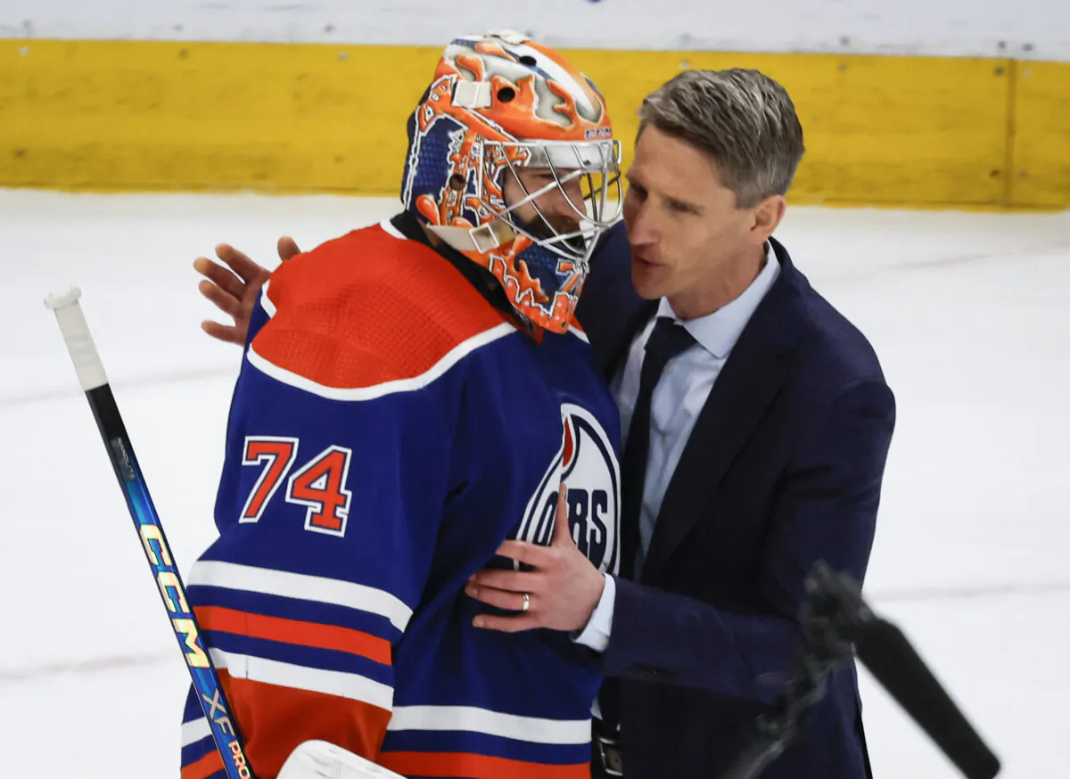 Edmonton Oilers goalie Stuart Skinner (74) is congratulated by head coach Kris Knoblauch after defeating the Dallas Stars in Game 6 of the Western Conference finals in Edmonton, Canada, on June 2, 2024. (Jeff McIntosh/The Canadian Press via AP)