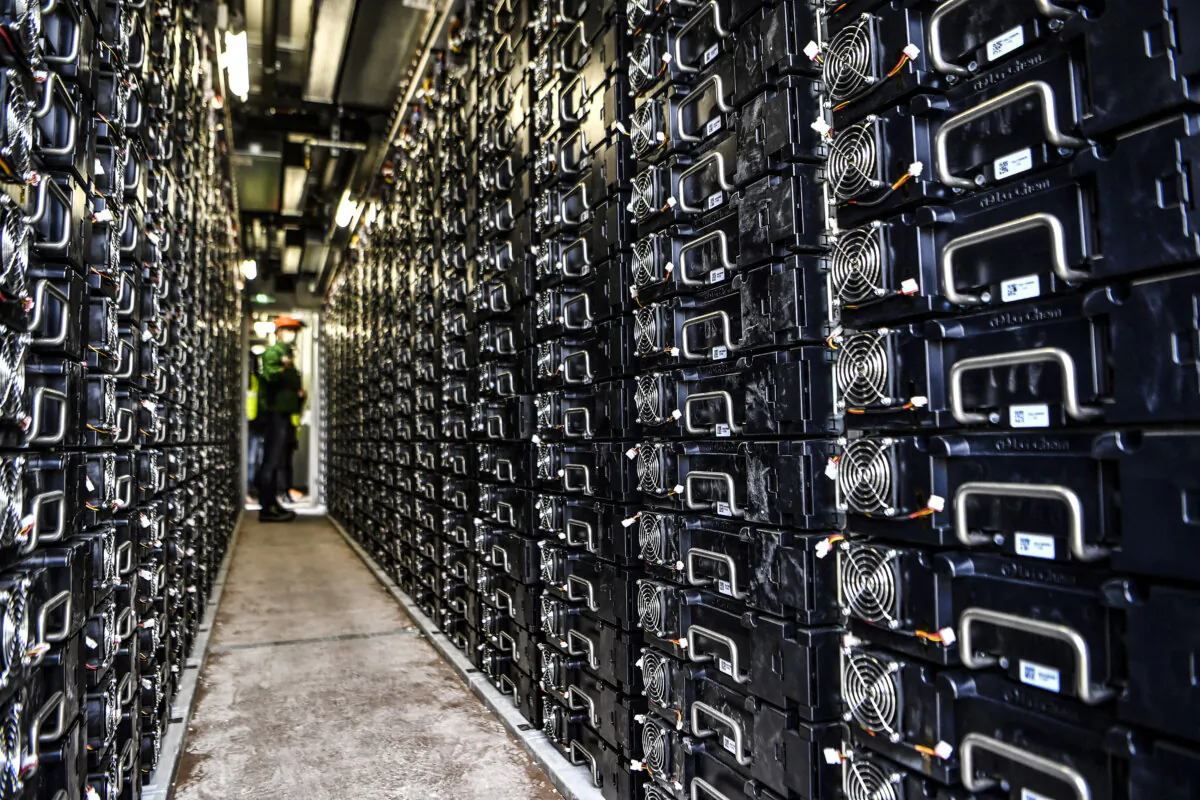 A worker controls batteries in an electricity storage container in Fontenelle, France, on Sept. 29, 2020. (Philippe Desmazes/AFP via Getty Images)