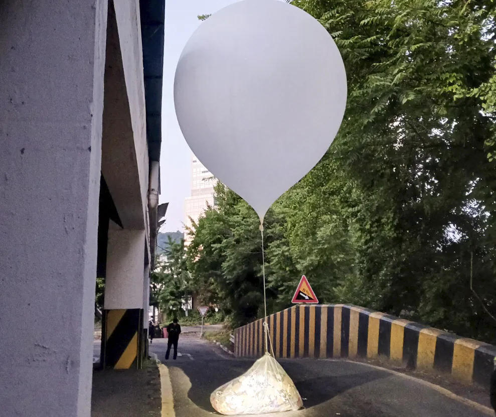 A balloon believed to have been sent by North Korea, carrying various objects including what appeared to be trash, is pictured in Incheon, South Korea, on June 2, 2024. (Yonhap via REUTERS