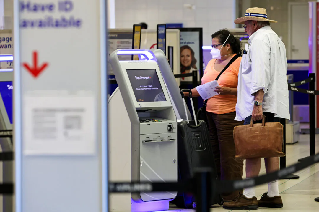 Travelers check themselves in at a kiosk at Philadelphia International Airport in Philadelphia, Pa., on Sept. 2, 2022. (Alex Wong/Getty Images)