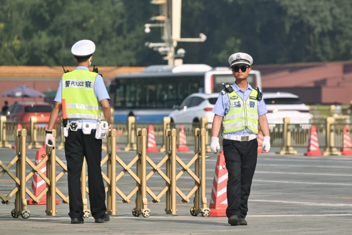 Policemen on Tiananmen Square in Beijing, in an undated file photograph.  (Adek Berry/AFP via Getty Images)