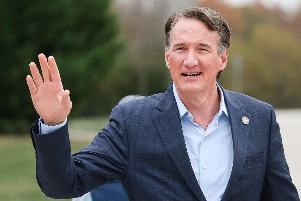 Virginia Governor Glenn Youngkin gestures to supporters while arriving at Piney Branch Elementary School in Bristow, Va., on Nov. 7, 2023. (Win McNamee/Getty Images)