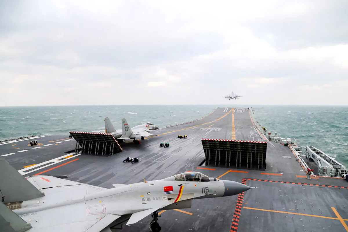 Chinese J-15 fighter jets are launching from the deck of the Liaoning aircraft carrier during military drills in the Yellow Sea, off China's east coast on Dec. 23, 2016. (STR/AFP via Getty Images)