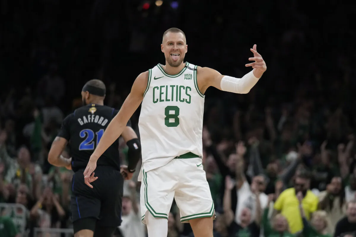 Kristaps Porzingis of the Boston Celtics celebrates a 3-pointer during Game 1 of the NBA Finals in Boston on June 6, 2024. (Charles Krupa/AP Photo)