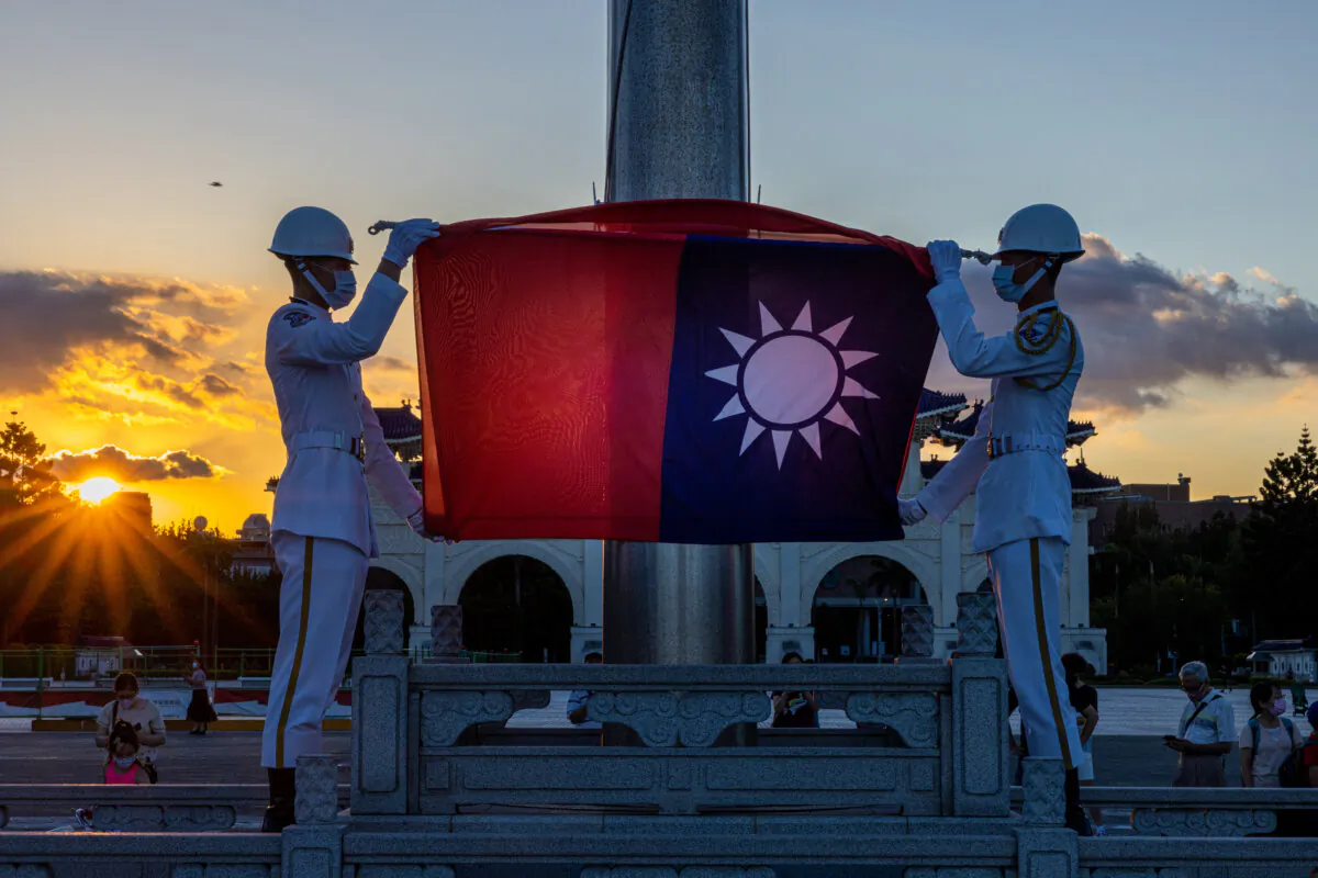 A flag-lowering ceremony takes place at Liberty Square in Taipei, Taiwan, on Aug. 9, 2022. (Annabelle Chih/Getty Images)