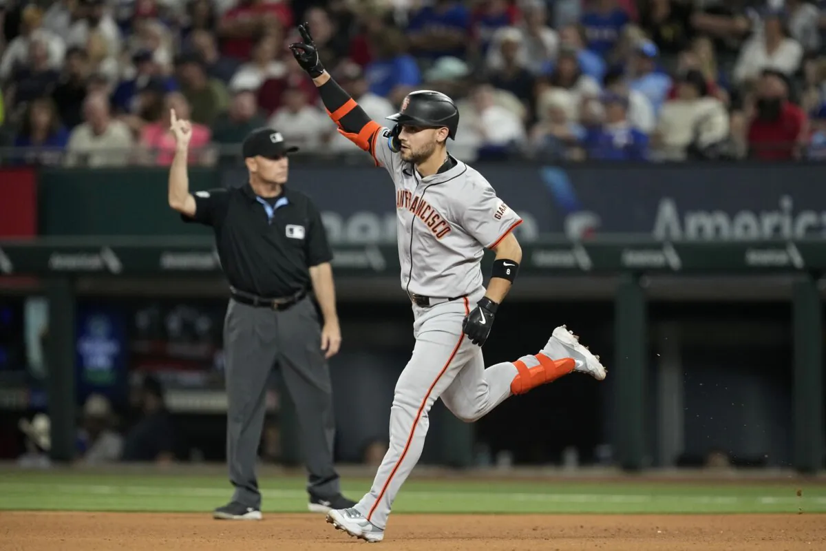 San Francisco Giants' Michael Conforto celebrates his two-run home run against the Texas Rangers in the seventh inning of a baseball game in Arlington, Texas, on June 7, 2024. (Tony Gutierrez/AP Photo)