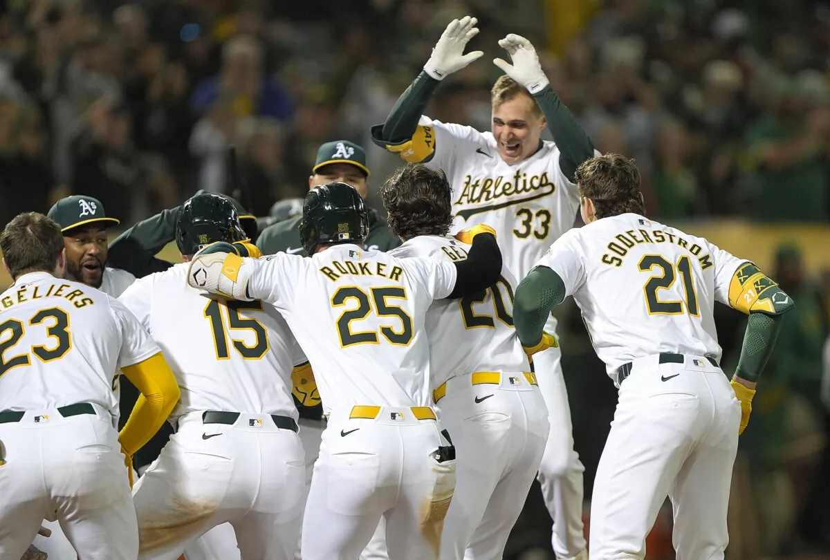 JJ Bleday (33) of the Oakland Athletics celebrates with teammates after he hit a solo walk-off home run against the Toronto Blue Jays in the bottom of the ninth inning in Oakland on June 7, 2024. (Thearon W. Henderson/Getty Images)
