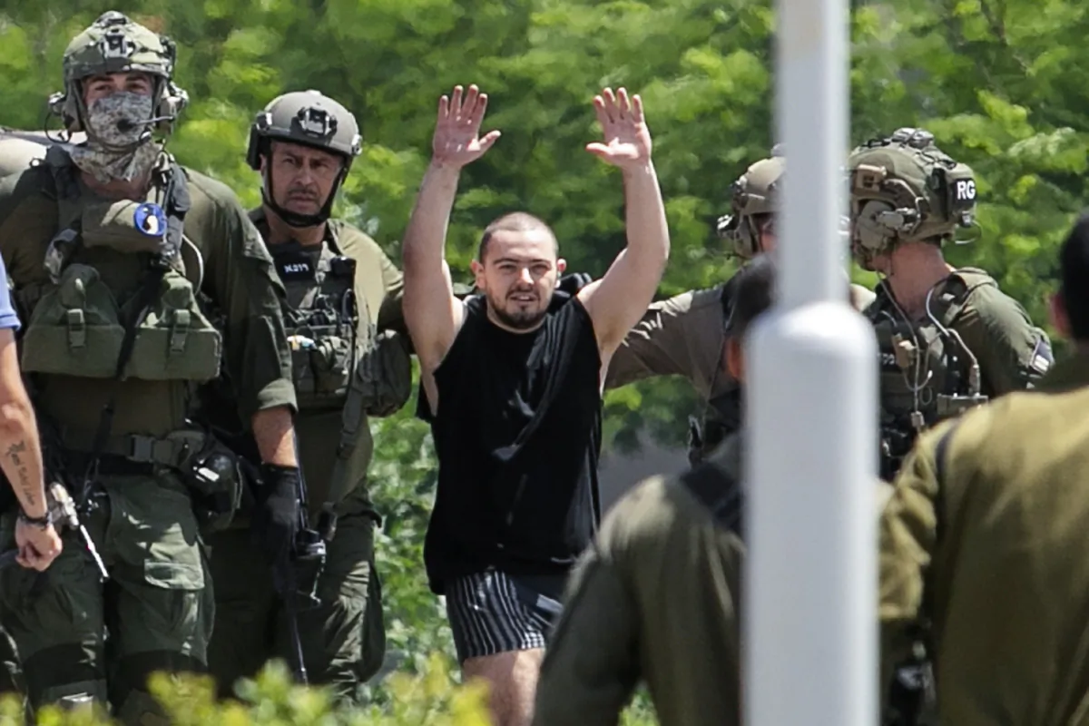 Almog Meir, kidnapped from Israel in a Hamas-led attack on Oct. 7, 2023, raises his hands after arriving by helicopter to the Sheba Medical Center in Ramat Gan, Israel, on June 8, 2024. (Tomer Appelbaum/AP Photo)