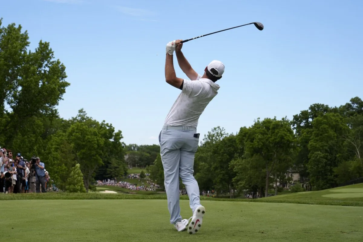 Scottie Scheffler hits from the second tee in the third round of the Memorial golf tournament in Dublin, Ohio, on June 8, 2024. (Sue Ogrocki/AP Photo)