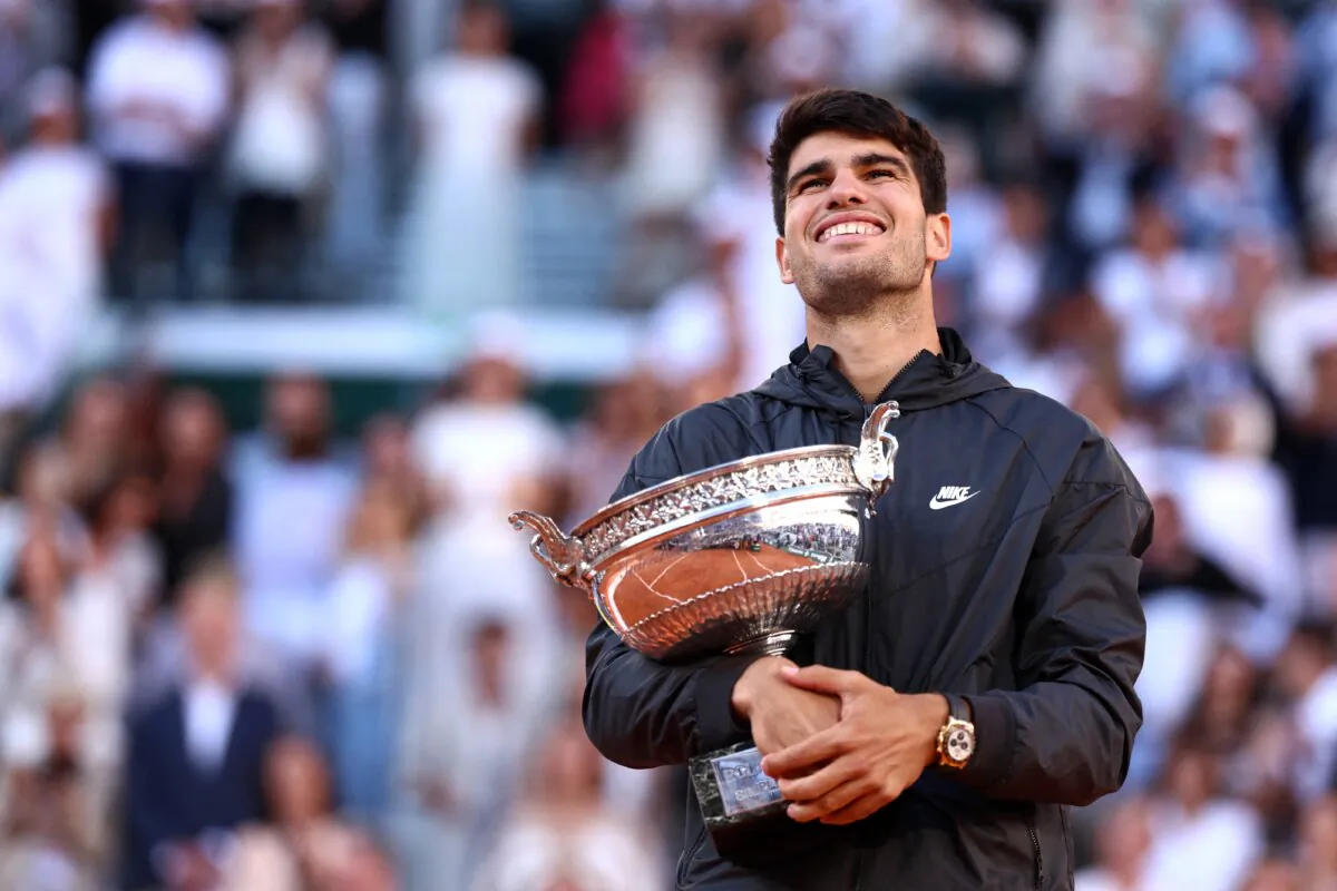 Spain's Carlos Alcaraz celebrates with the trophy after winning against Germany's Alexander Zverev at the end of their men's singles final match in Paris on June 9, 2024. (Emmanuel Dunand/AFP via Getty Images)