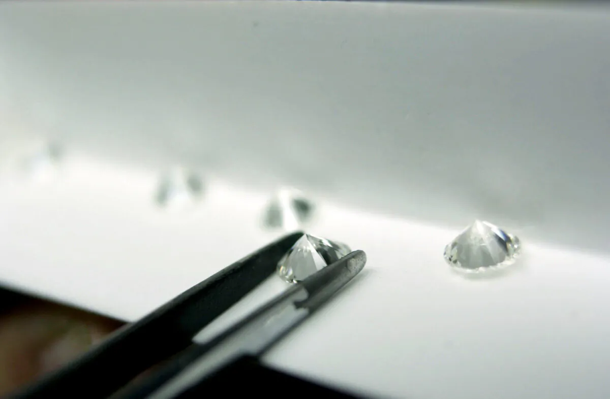 A diamond factory employee sorts polished diamonds in a file photo. (Paul O'Driscoll/Getty Images)