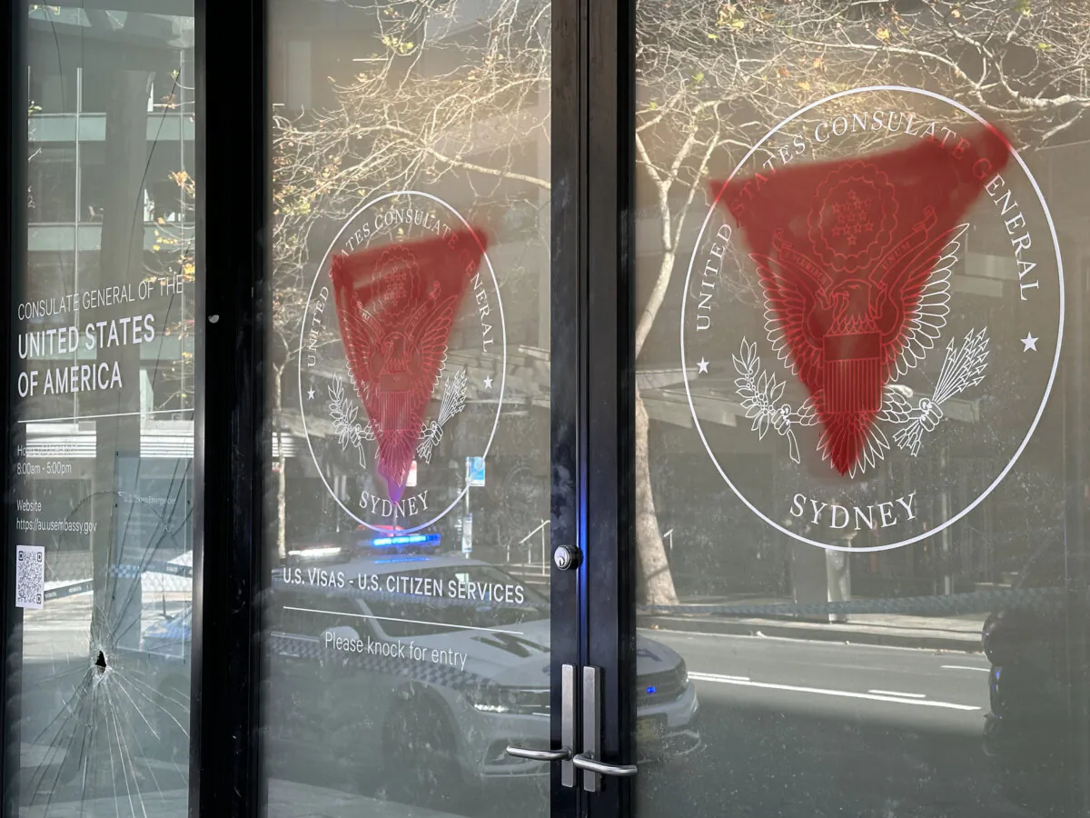 Pro-Palestinian symbols are seen spray painted on the windows of the U.S. Consulate in Sydney, Australia, on June 10, 2024. (AAP Image/Stephanie Moring)
