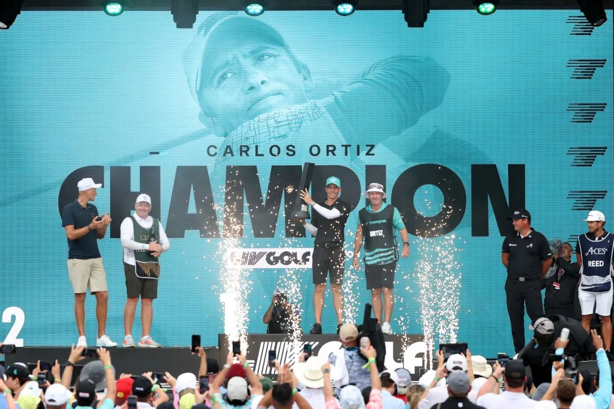Carlos Ortiz of Torque GC is presented with the individual championship trophy after during day three of the LIV Golf Invitational—Houston in Humble, Texas, on June 9, 2024. (Tim Warner/Getty Images)