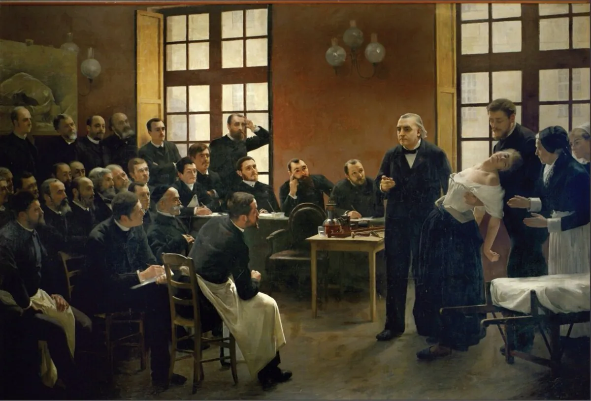 "A Clinical Lesson at the Salpêtrière," 1887, by Andre Brouillet, depicts French neurologist Jean-Martin Charcot's intern, Georges Gilles de la Tourette (seated in first row, wearing apron). Charcot named Tourette Syndrome after his assistant. The TV movie, “Front of the Class,” brings Tourette Syndrome into the modern day.