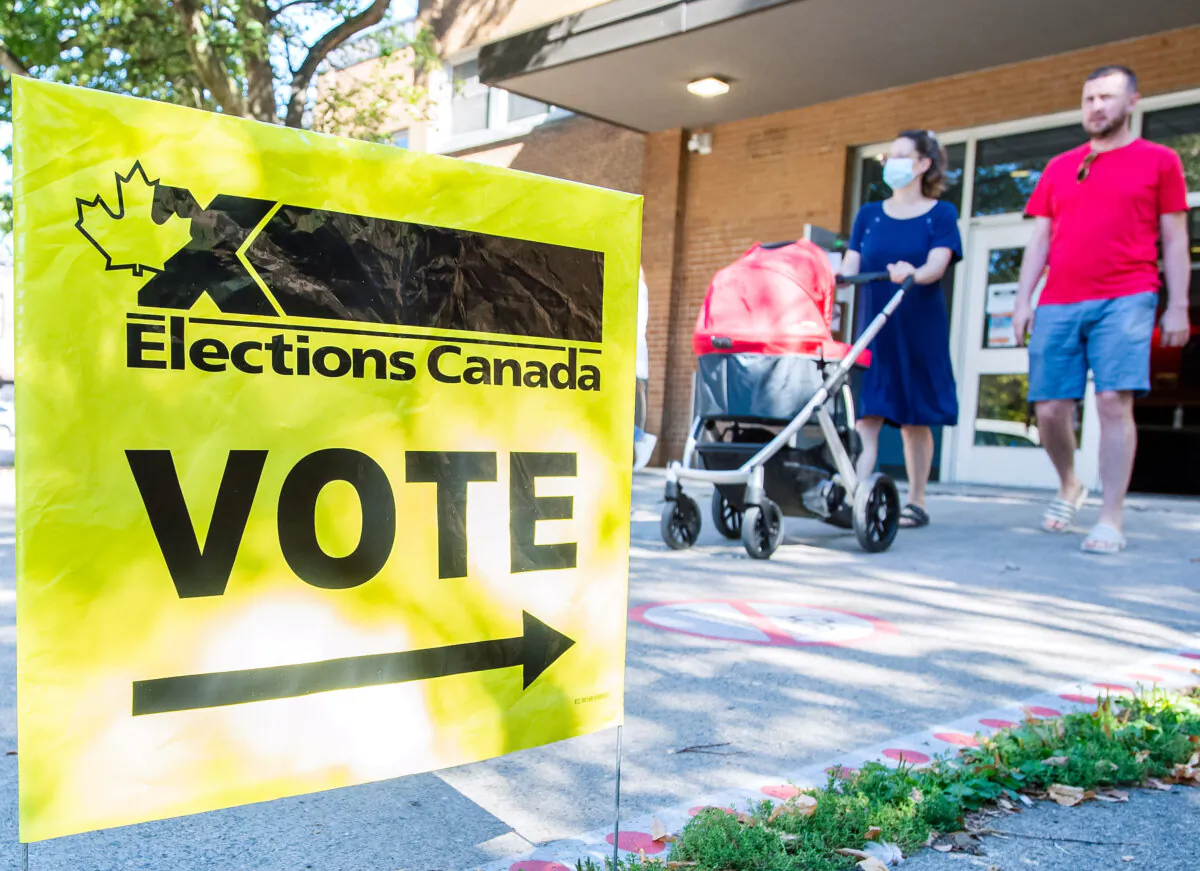 People leave a polling station after voting on federal election day in Montreal on Sept. 20, 2021. (The Canadian Press/Graham Hughes)