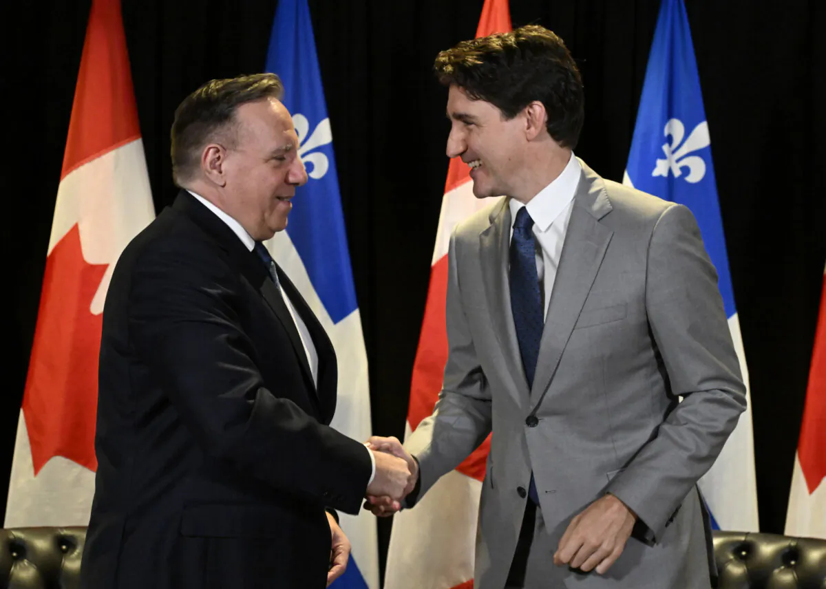 Prime Minister Justin Trudeau (R) and Quebec Premier Francois Legault shake hands as they meet, in Quebec City, on June 10, 2024. (The Canadian Press/Jacques Boissinot)
