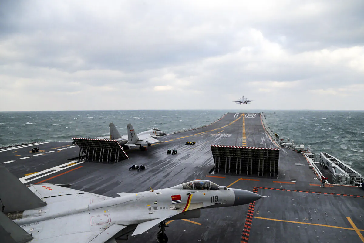 Chinese J-15 fighter jets launch from the deck of the Liaoning aircraft carrier during military drills in the Yellow Sea, off China's east coast, on Dec. 23, 2016. (STR/AFP via Getty Images)