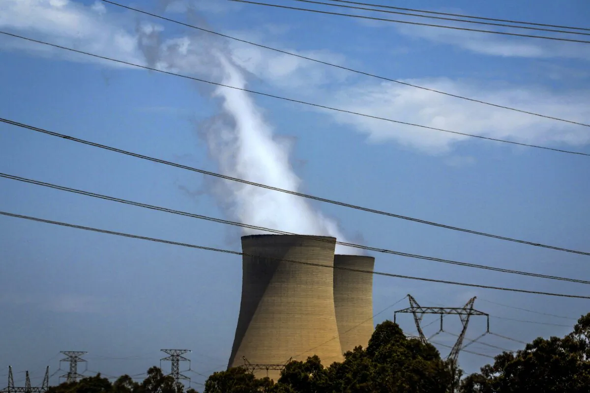 Electricity lines near emission funnels for the Bayswater coal-powered thermal power station in Muswellbrook, Australia, on Dec. 13, 2023. (David Gray/AFP via Getty Images)