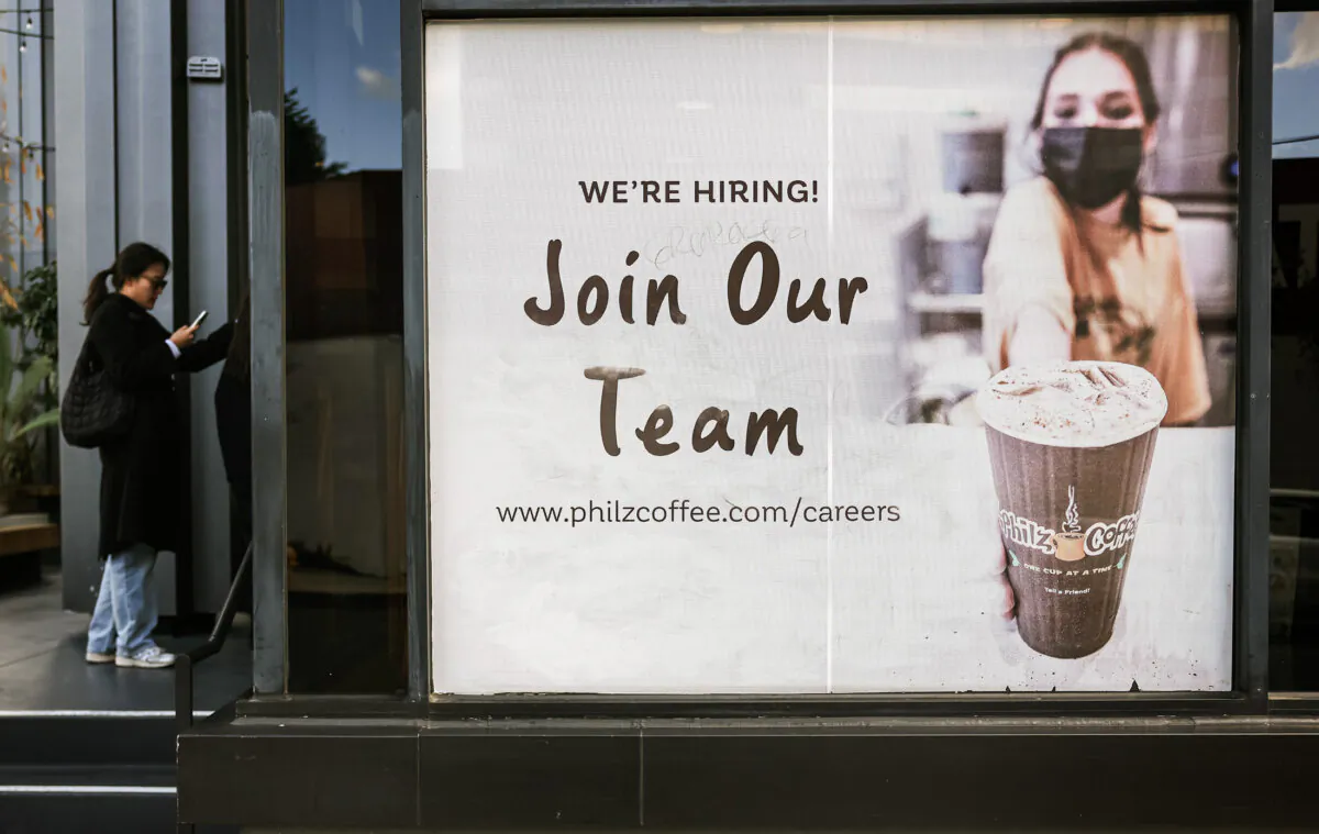 A "We're Hiring" hiring sign is posted outside a coffee shop in Los Angeles on Jan. 3, 2024. (Mario Tama/Getty Images)