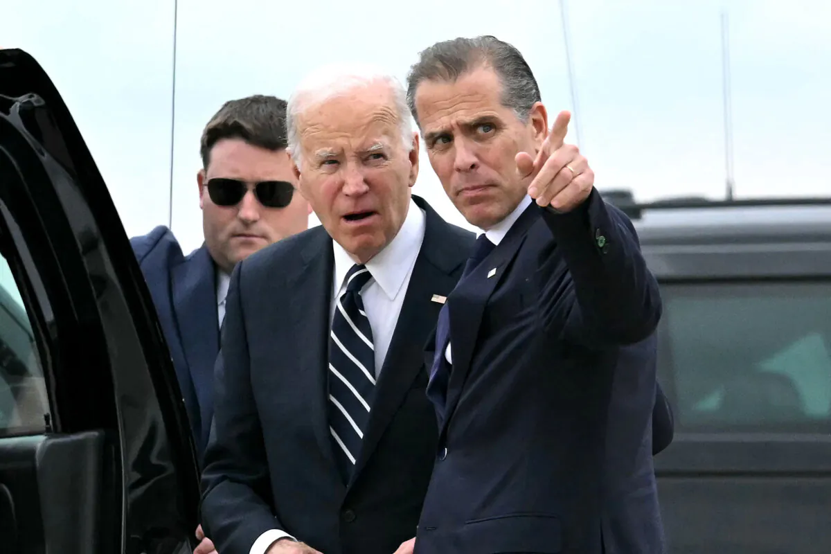 President Joe Biden talks with his son Hunter Biden upon arrival at Delaware Air National Guard Base in New Castle, Del., on June 11, 2024. (Andrew Caballero-Reynolds/AFP via Getty Images)