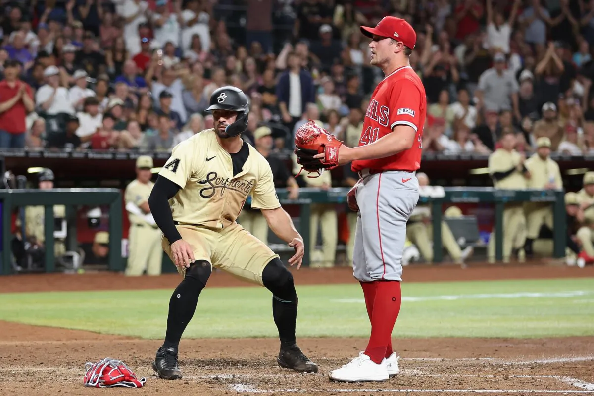 Randal Grichuk (15) of the Arizona Diamondbacks scores a run on a wild pitch from relief pitcher Carson Fulmer (41) of the Los Angeles Angels during the fifth inning of the MLB game at Chase Field in Phoenix on June 11, 2024. (Christian Petersen/Getty Images)