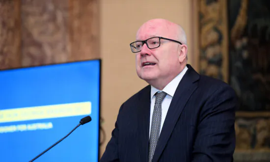 Ex-Attorney General Warns Against Public Indifference Towards Global Conflict