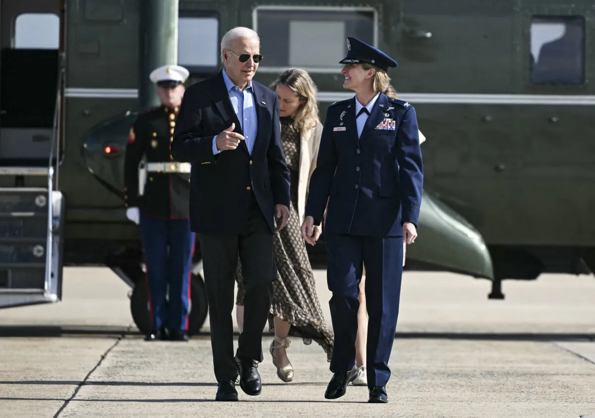 President Joe Biden is welcomed by Air Force Col. Angela Ochoa as he arrives to board Air Force One at Joint Base Andrews in Maryland on June 12, 2024. (Mandel Ngan/AFP via Getty Images)
