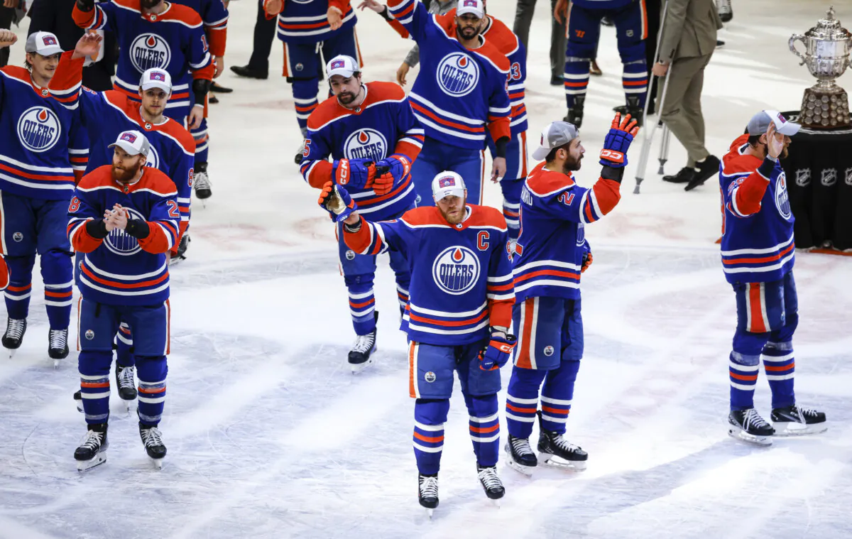 Edmonton Oilers players wave to fans after defeating the Dallas Stars in Game 6 of the Western Conference finals of the NHL hockey Stanley Cup playoffs in Edmonton on June 2, 2024. (Jeff McIntosh/The Canadian Press via AP)