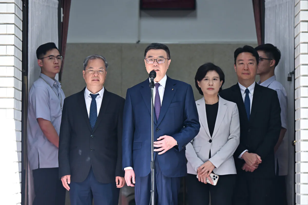 Premier of the Republic of China (Taiwan) Cho Jung-tai (C) addresses the public's concern over the Chinese man who took a speedboat into Taipei pier, in front of the Legislative Yuan on June 11, 2024. (Sung Pi Lung/The Epoch Times)