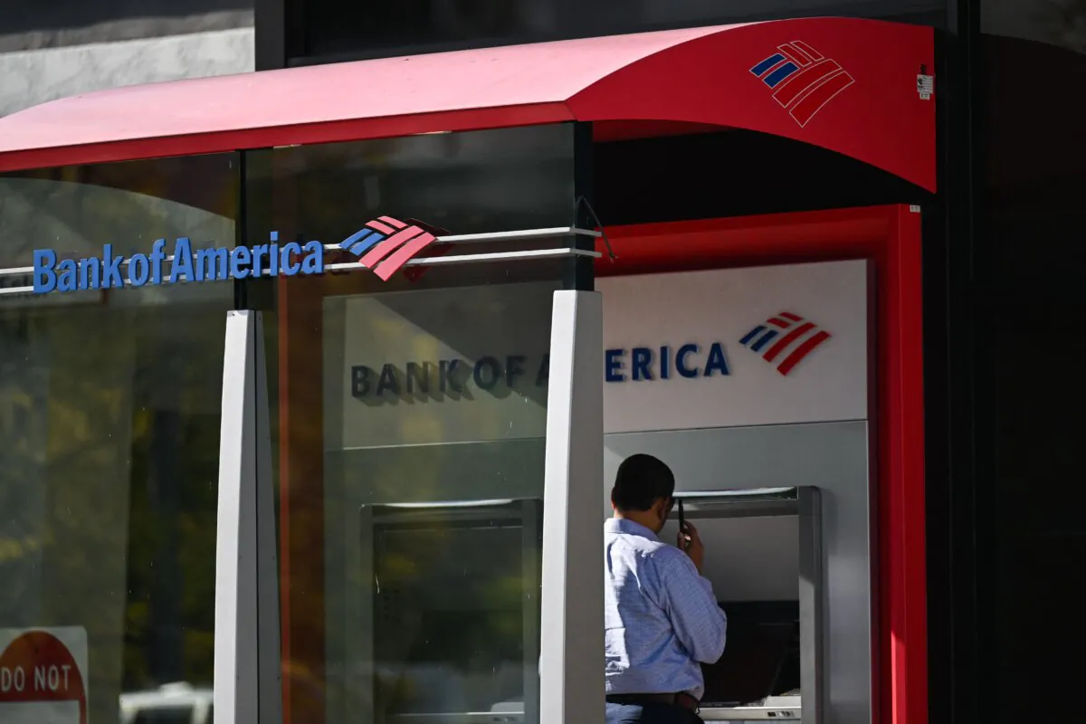 A customer uses an ATM outside of a Bank of America branch in Rolling Hills Estates, Calif., on March 13, 2023. (Patrick T. Fallon/AFP via Getty Images)