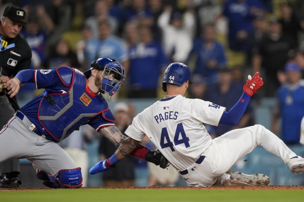Texas Rangers catcher Jonah Heim (L) tags out Los Angeles Dodgers' Andy Pages sliding home to end the baseball game in Los Angeles on June 12, 2024. (Ryan Sun/AP Photo)