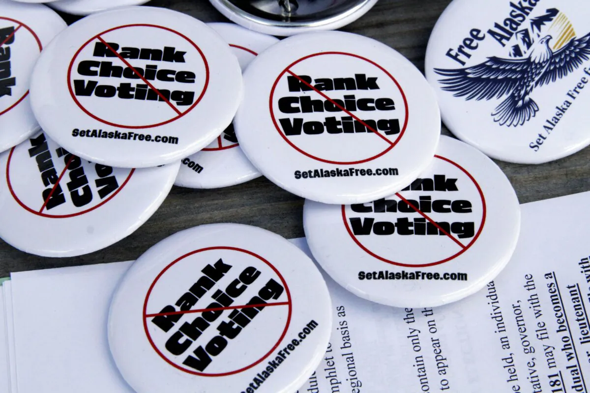 Campaign buttons urging Alaskans to repeal ranked choice voting in their state sit on a picnic table at the home of Phil Izon, a backer of the initiative, in Wasilla, Alaska, on May 14, 2024. (Mark Thiessen/AP Photo)