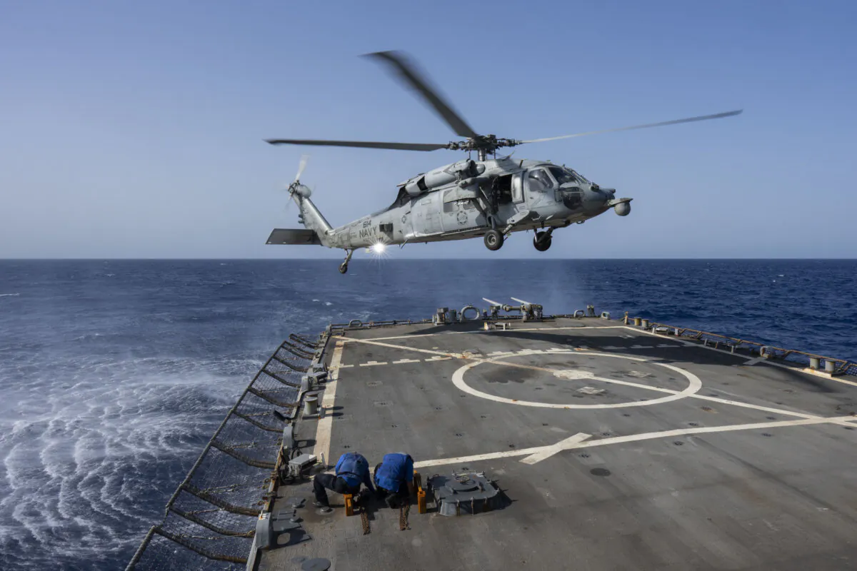An HSC-7 helicopter lands on the Arleigh Burke-class guided missile destroyer USS Laboon in the Red Sea, on June 12, 2024. (Bernat Armangue/AP Photo)