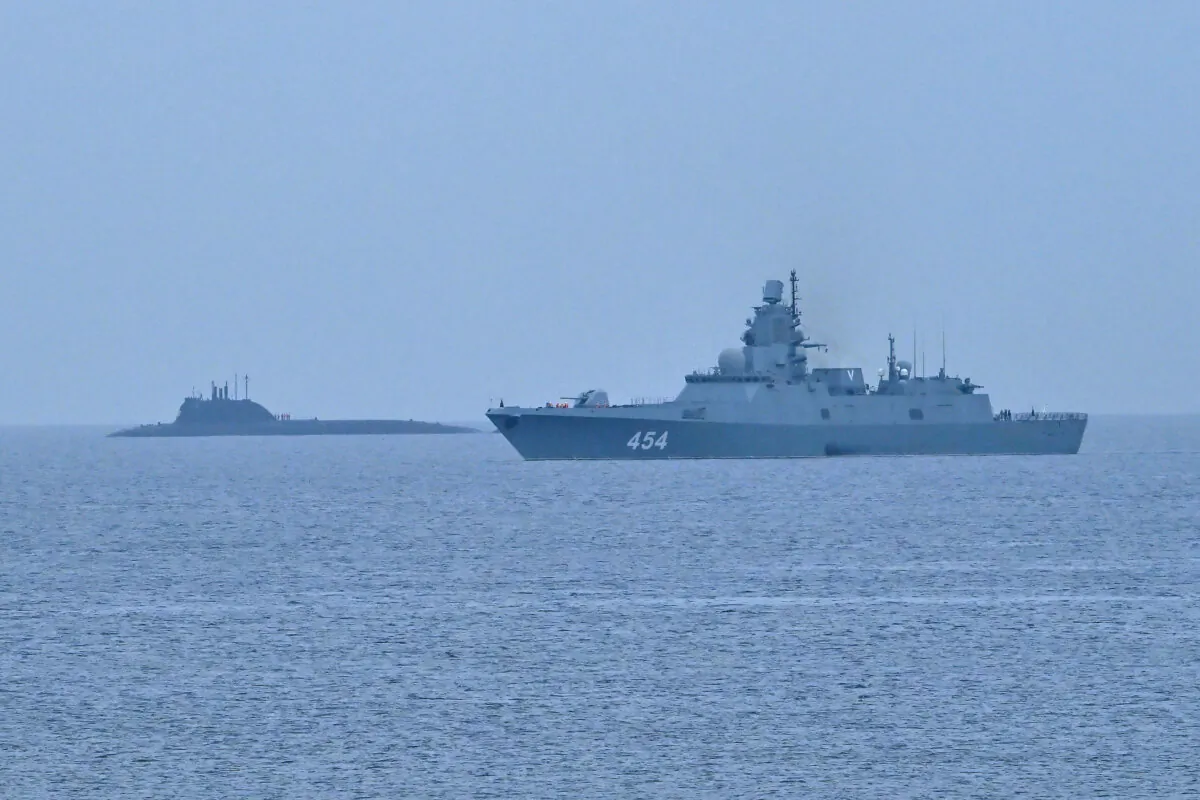 The Russian nuclear-powered submarine Kazan (L) and the class frigate Admiral Gorshkov, part of the Russian naval detachment visiting Cuba, arrive at Havana's harbour, June 12, 2024. (ADALBERTO ROQUE/AFP via Getty Images)