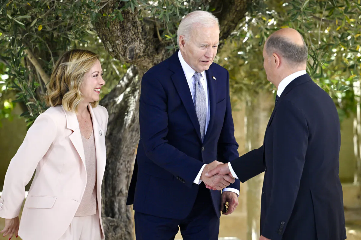 Italian Prime Minister Giorgia Meloni (L) greets U.S. President Joe Biden and German Chancellor Olaf Scholz during a welcome ceremony on day one of the 50th G7 summit at Borgo Egnazia in Fasano, Italy, on June 13, 2024. (Antonio Masiello/Getty Images)