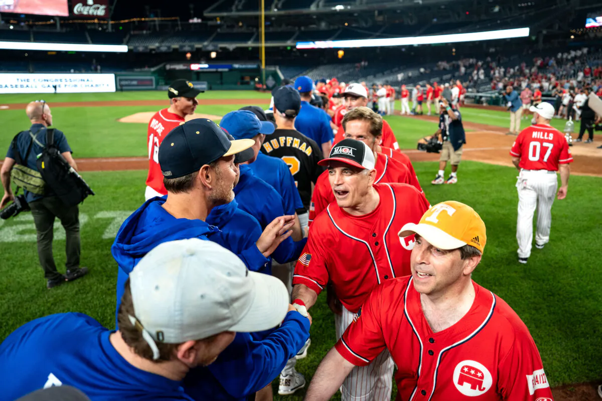 Members of the Democrat (L) and Republican teams shake hands following the Congressional Baseball Game for Charity at Nationals Park on June 12, 2024 in Washington. The annual bipartisan game was first played in 1909. (Kent Nishimura/Getty Images)