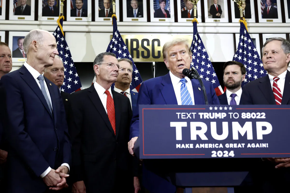 Republican presidential candidate, former President Donald Trump, flanked by Senate Republicans, gives remarks to the press at the National Republican Senatorial Committee building in Washington on June 13, 2024. (Anna Moneymaker/Getty Images)