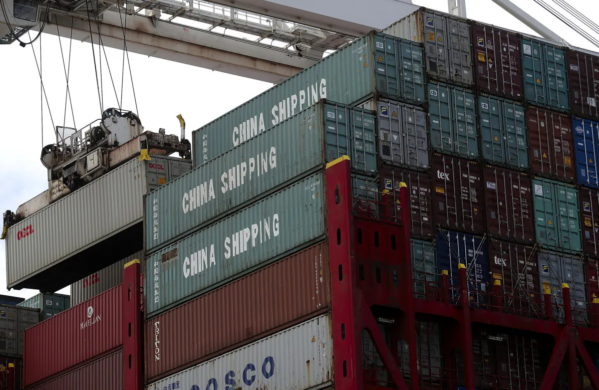 A shipping container is offloaded from the Hong Kong-based CSCL East China Sea container ship at the Port of Oakland in Oakland, Calif., on June 20, 2018. (Justin Sullivan/Getty Images)