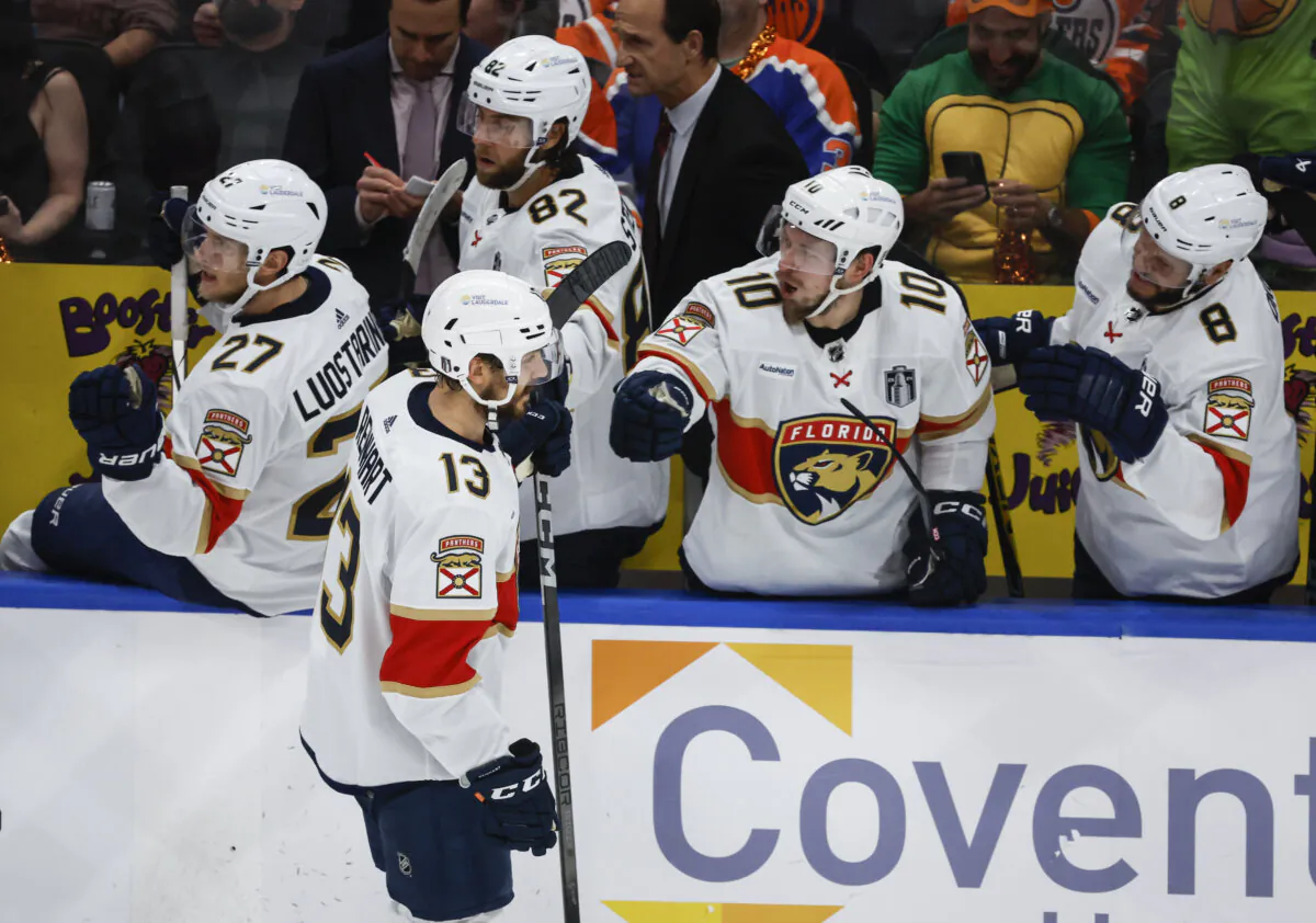 Sam Reinhart receives congratulations from teammates on the Florida Panthers' bench after scoring a first-period goal against the Edmonton Oilers in Game 3 of the Stanley Cup Final in Edmonton, Canada, on June 13, 2024. (Jeff McIntosh/The Canadian Press via AP)