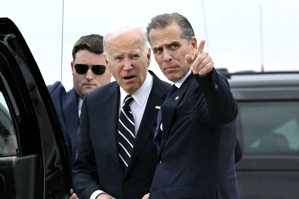 President Joe Biden talks with his son Hunter Biden upon arrival at Delaware Air National Guard Base in New Castle, Del., on June 11, 2024. (Andrew Caballero-Reynolds/AFP via Getty Images)