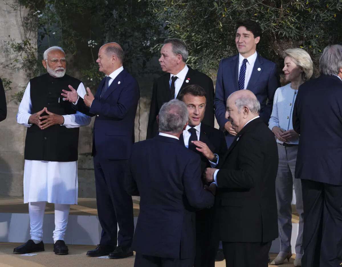 Prime Minister Justin Trudeau (3rd R) and Prime Minister of India Narendra Modi (L) take part in a family photo during the G7 Summit in Savelletri Di Fasano, Italy on June 14, 2024. (Sean Kilpatrick/The Canadian Press)