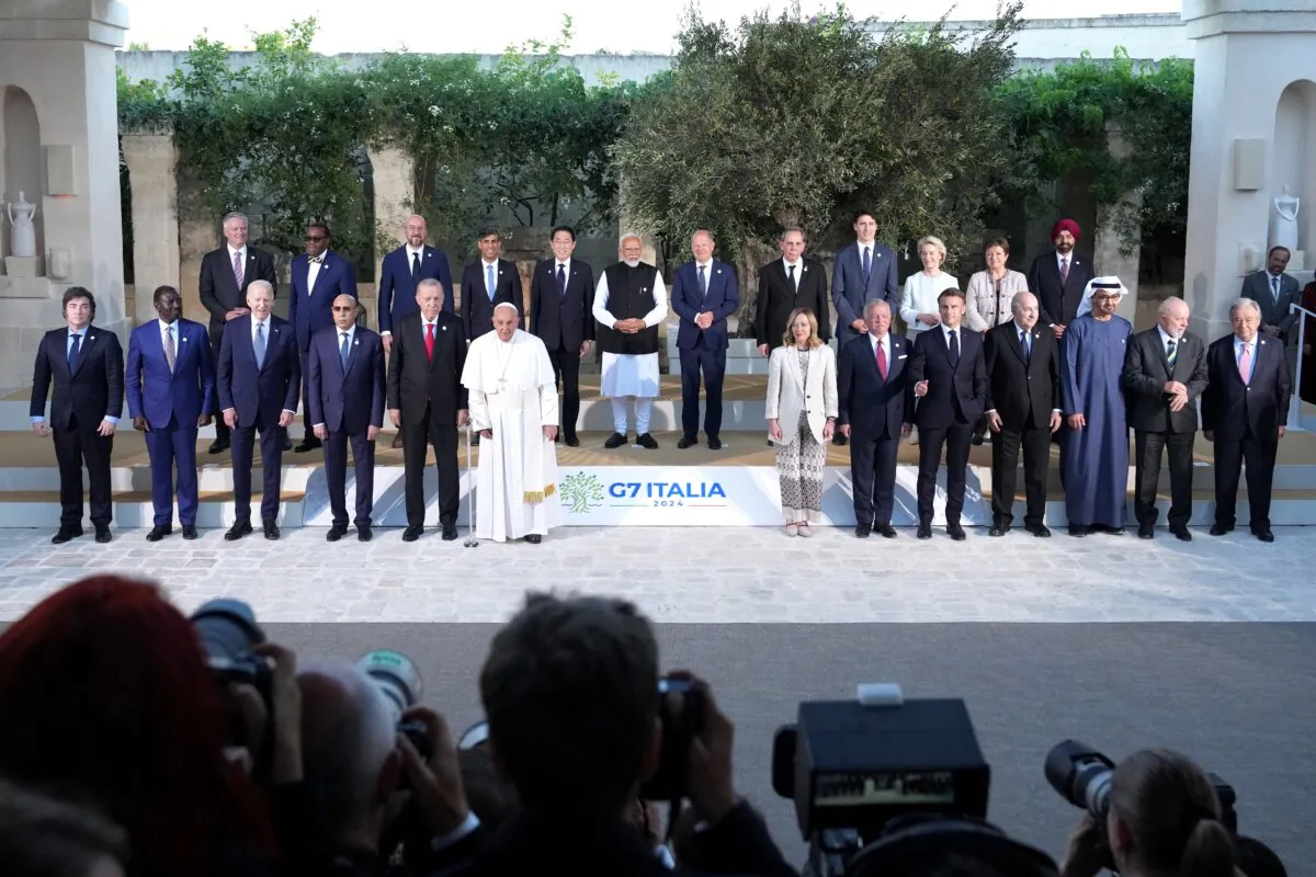 Pope Francis poses with the G7 heads of state, heads of delegation of Outreach countries, Charles Michel, president of the European Council, and Ursula von der Leyen, president of the European Commission, for a photo on day two of the 50th G7 summit at Borgo Egnazia in Fasano, Italy, on June 14, 2024. (Christopher Furlong/Getty Images)