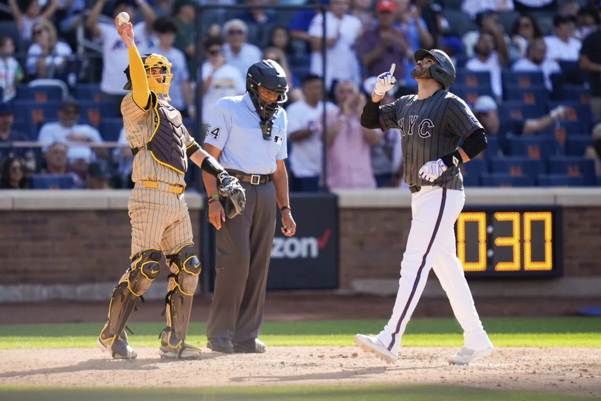 New York Mets' J.D. Martinez (R) celebrates after as he crosses home plate after hitting a home run in the fourth inning of a baseball game against the San Diego Padres in New York on June 15, 2024. (Julia Nikhinson/AP Photo)