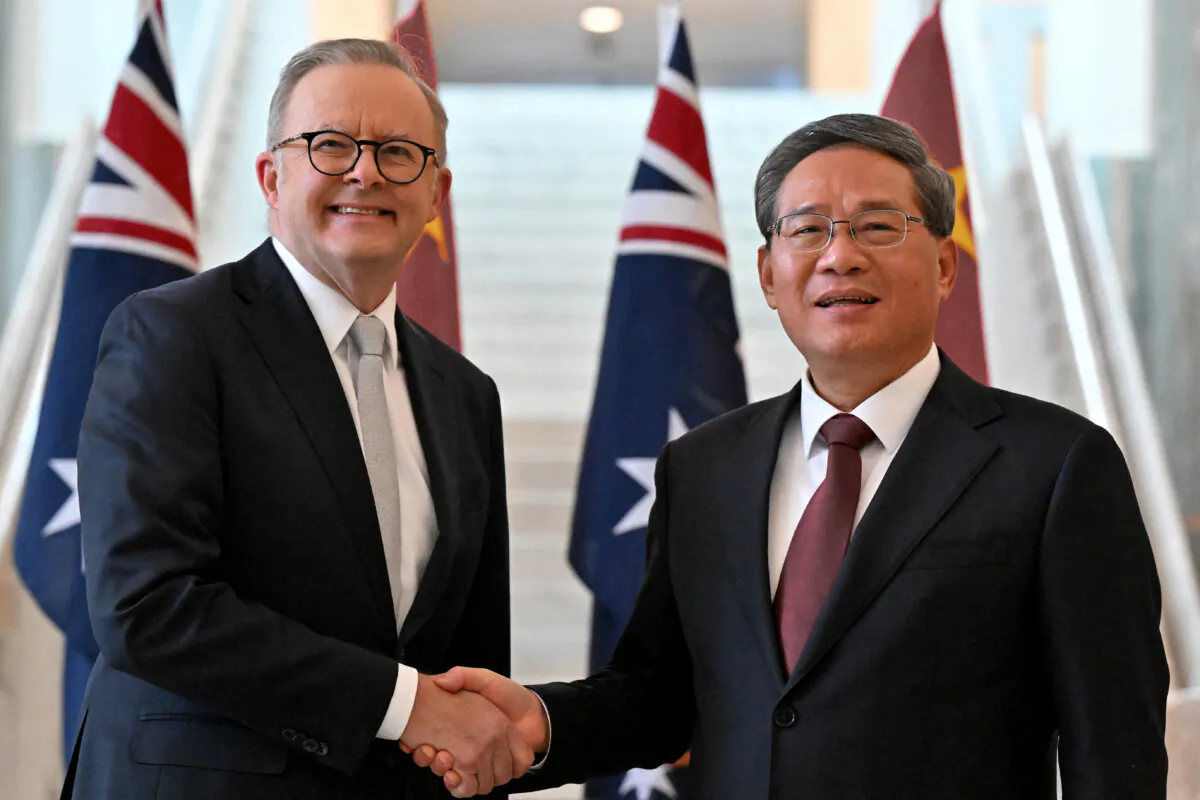 Australia's Prime Minister Anthony Albanese (L) shakes hands with the CCP Premier Li Qiang at Parliament House in Canberra, Australia on June 17, 2024. (Mick Tsikas/Pool/AFP via Getty Images)